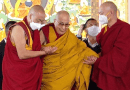 Frail Dalai Lama being supported by two monks. Credit: Kalinga Seneviratne