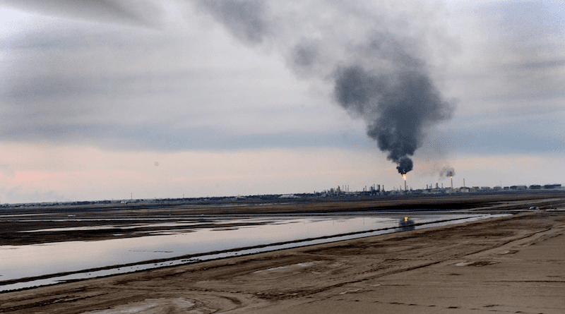 File photo of Gas/ Oil Separation Plants flare in Basra, Iraq. Photo Credit: Sgt. Gustavo Olgiati, DOD