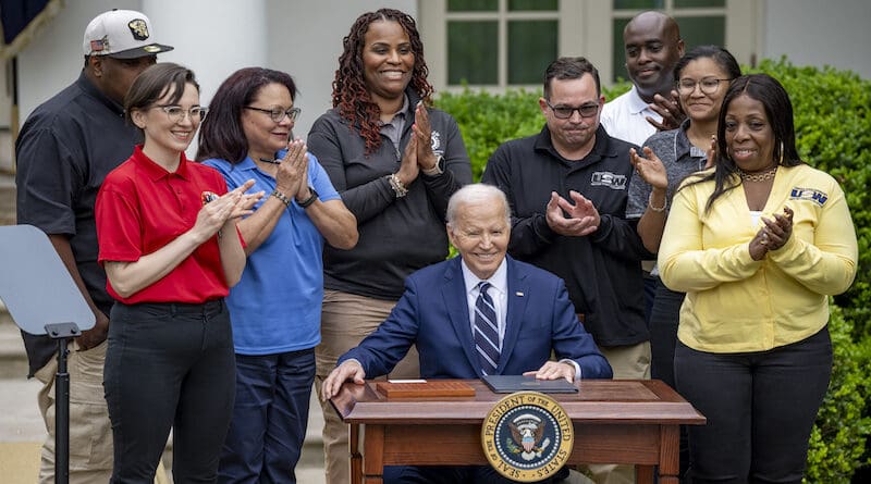 President Joe Biden signs a document in the Rose Garden of the White House in Washington, Tuesday, May 14, 2024, imposing major new tariffs on electric vehicles, semiconductors, solar equipment and medical supplies imported from China. Photo Credit: POTUS, X