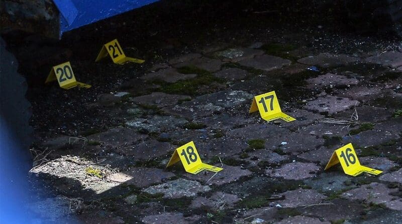 Bullet casings marked with numbers by the police are seen at the site of an attack at the Ulu Tiram Police Station in Johor Bahru, Johor state, Malaysia, May 17, 2024. [S. Mahfuz/BenarNews]