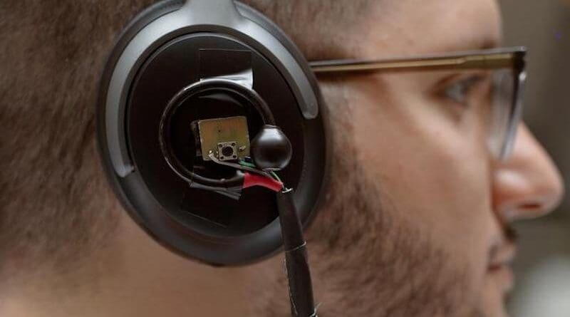 A University of Washington team has developed an artificial intelligence system that lets a user wearing headphones look at a person speaking for three to five seconds and then hear just the enrolled speaker’s voice in real time even as the listener moves around in noisy places and no longer faces the speaker. Pictured is a prototype of the headphone system: binaural microphones attached to off-the-shelf noise canceling headphones. CREDIT: Kiyomi Taguchi/University of Washington
