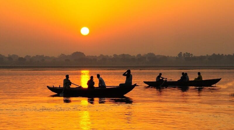 ganges river india boat people sun hot heat