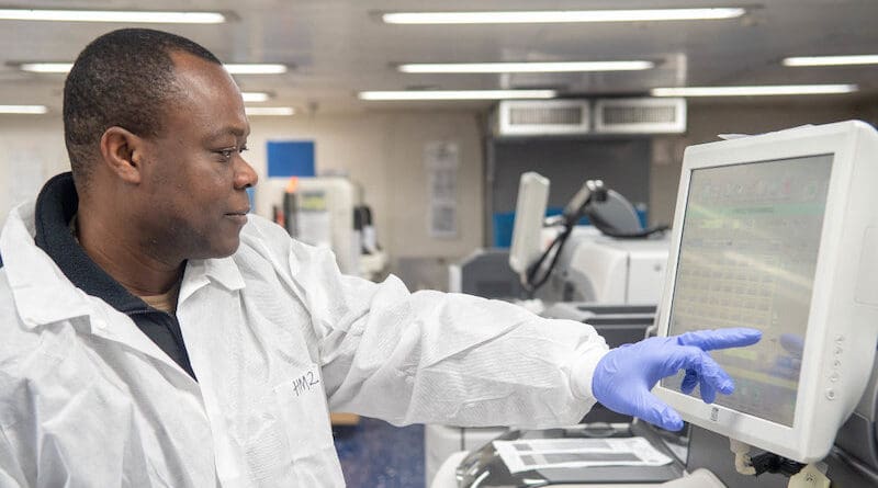 A Ghanaian, a laboratory technician assigned to hospital ship USNS Mercy, inputs and logs data samples in the ship’s laboratory in 2022. Investment is needed to improve data quality and availability. Copyright: Jake Greenberg (CC BY-NC 2.0)