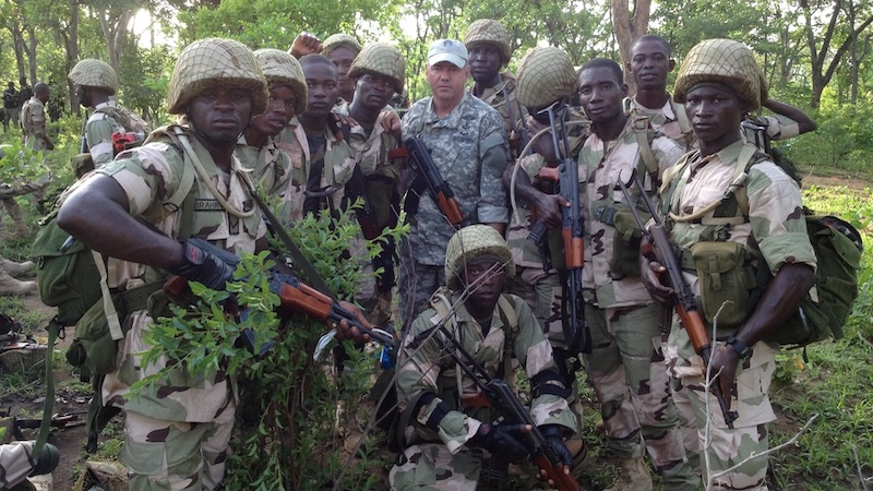 File photo of a California National Guard Special Forces soldier from Los Alamitos-based Special Operations Detachment–U.S. Northern Command and Company A, 5th Battalion, 19th Special Forces Group (Airborne), poses with Nigerian soldiers during a training mission in Nigeria. Photo Credit: Cpl. Danielle Rodrigues, DOD