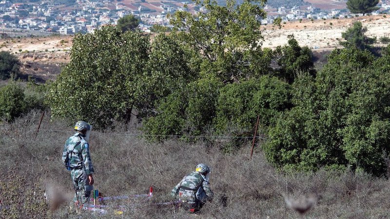 File photo of UNIFIL deminers checking an area along the Blue Line. Photo Credit: UNIFIL/Pasqual Gorriz