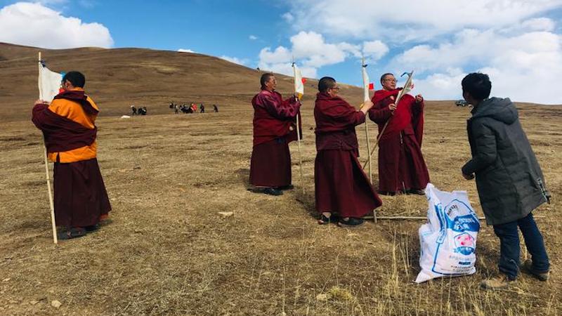 A pika (a small mammal)-expelling ritual at a grassland restoration site on the Qinghai-Tibetan Plateau in the northwest of China. CREDIT: Li Li