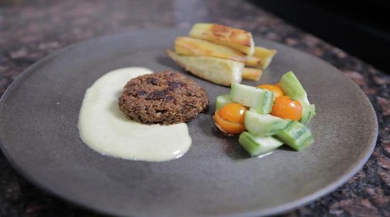 A sauteed patty composed of soy pulp innoculated with Neurospora mold and left to ferment for several days. UC Berkeley postdoctoral fellow Vayu Hill-Maini prepared and cooked the patty, plating it with a cashew cream sauce, baked yams and a fresh cherry tomato and cucumber salad. CREDIT: Vayu Hill-Maini, UC Berkeley