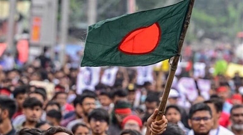 Protestors with the Bangladesh flag. Photo Credit: Tasnim News Agency