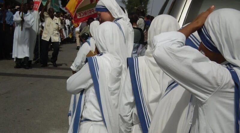 Missionaries of Charity during a religious procession in the streets of Port-au-Prince, Haiti. Photo Credit: Willuconquer, Wikimedia Commons